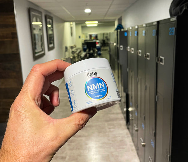 NMN Supplement in mans hand at a Gym