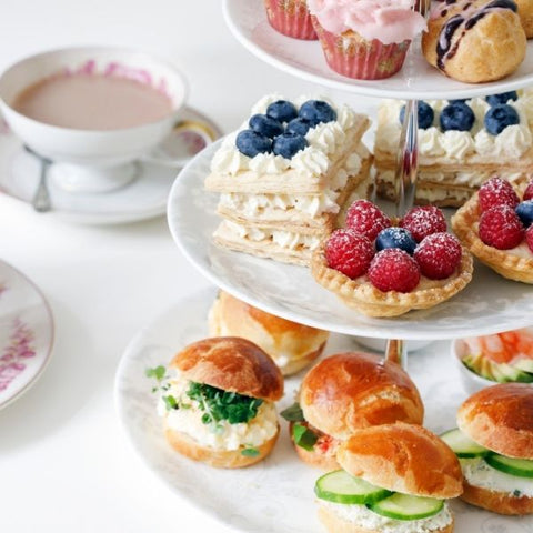 A selection of sandwiches, cakes and desserts for an afternoon tea