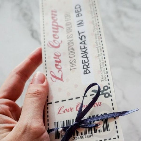 A handmade love coupon gift offering breakfast in bed 