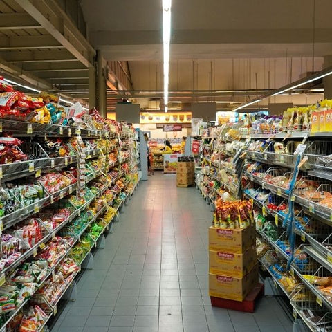 Shopping isle with lots of different brands of food