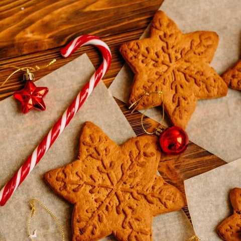 Freshly baked festive gingerbread snowflakes and candycanes