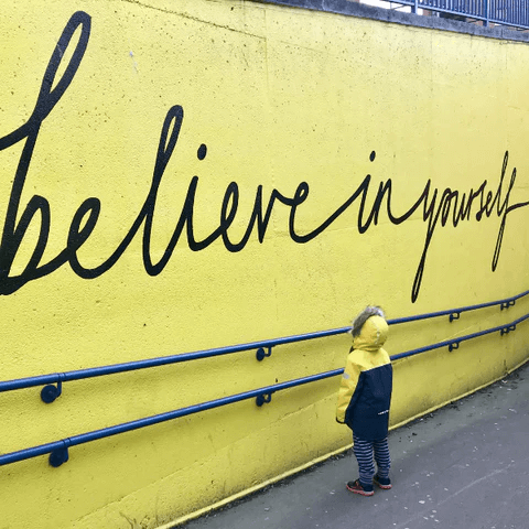 script text on wall - believe in yourself 