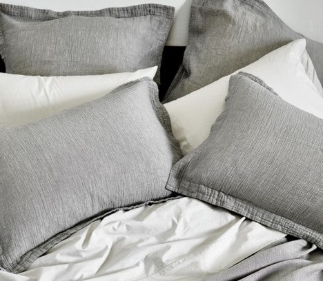 Gray down pillows on a bed