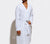 Man dressed in Essential White Honeycomb Bathrobe with white background.