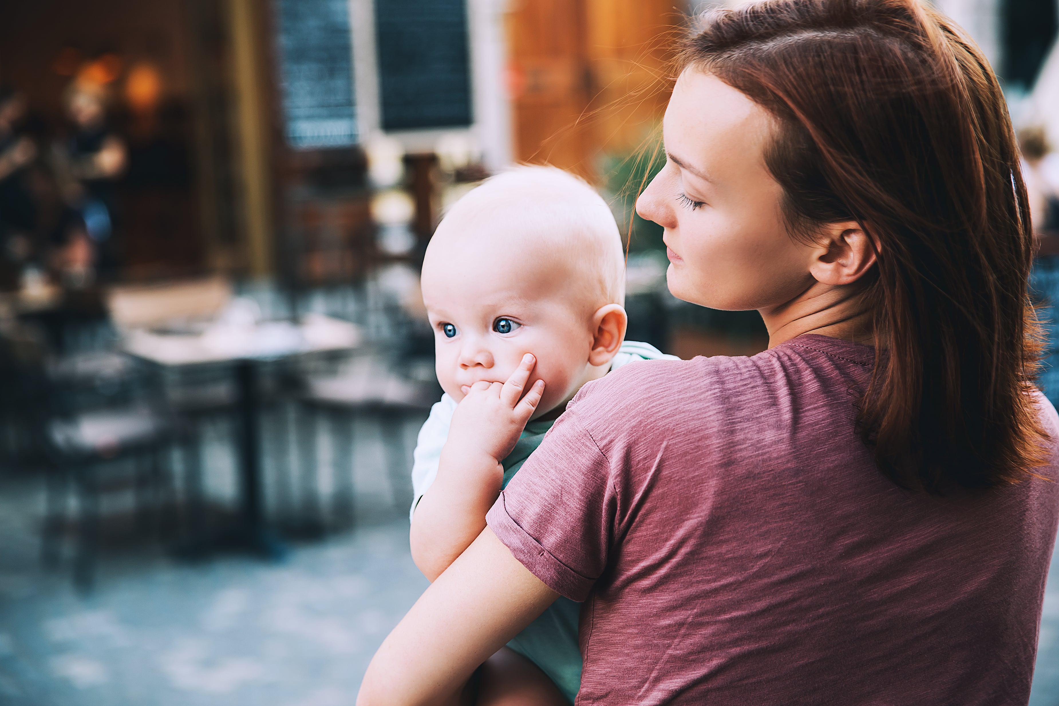 Mother learning how to help baby sleep when teething