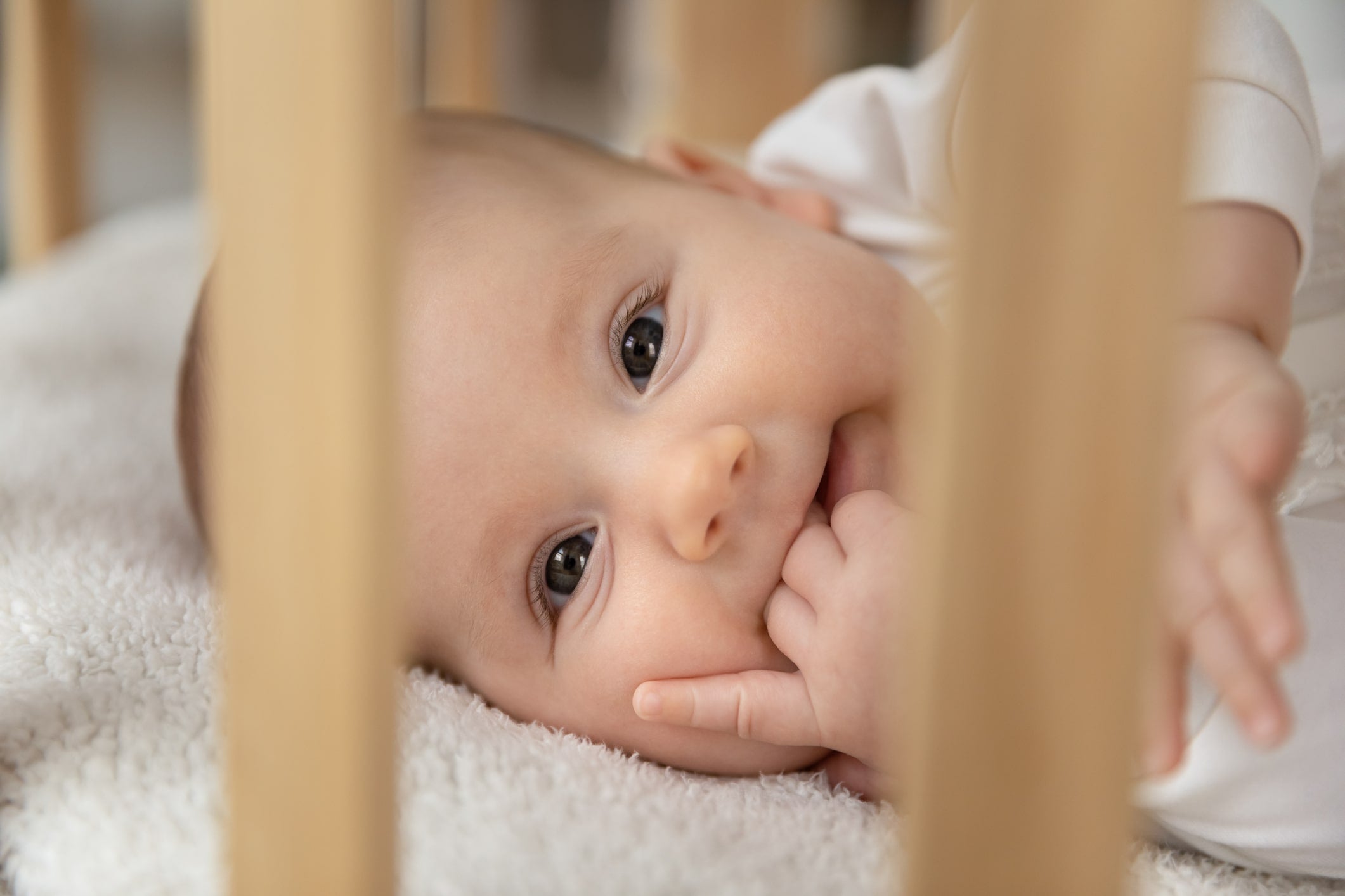 Baby on back in best sleeping position for teething baby