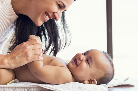 Mother holds baby while practicing tips for baby insomnia