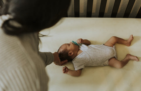 parent comforting baby 