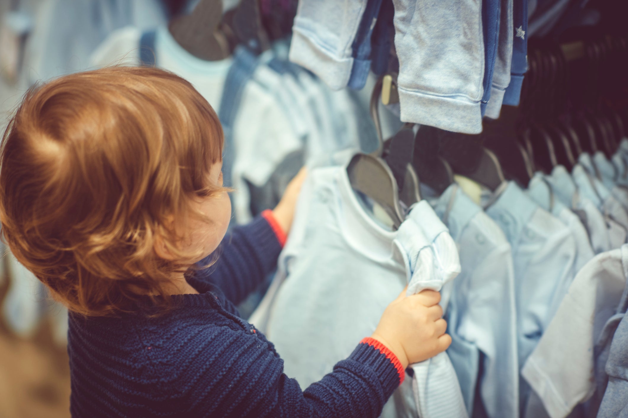 Child browsing different cozy baby pajamas 