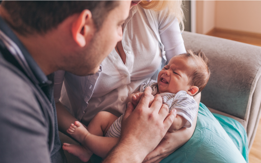 Parents handling a difficult baby crying at night and in the daytime