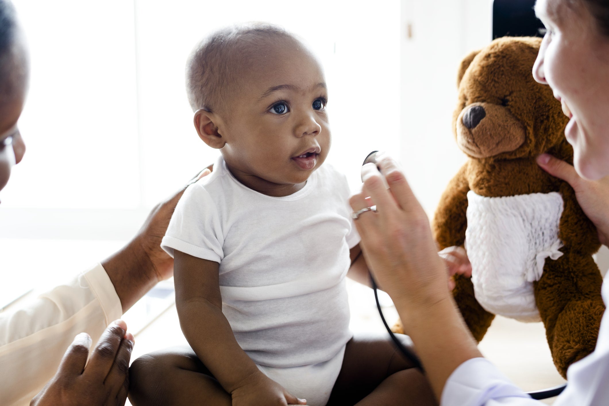 Doctor examining why baby cries in their sleep