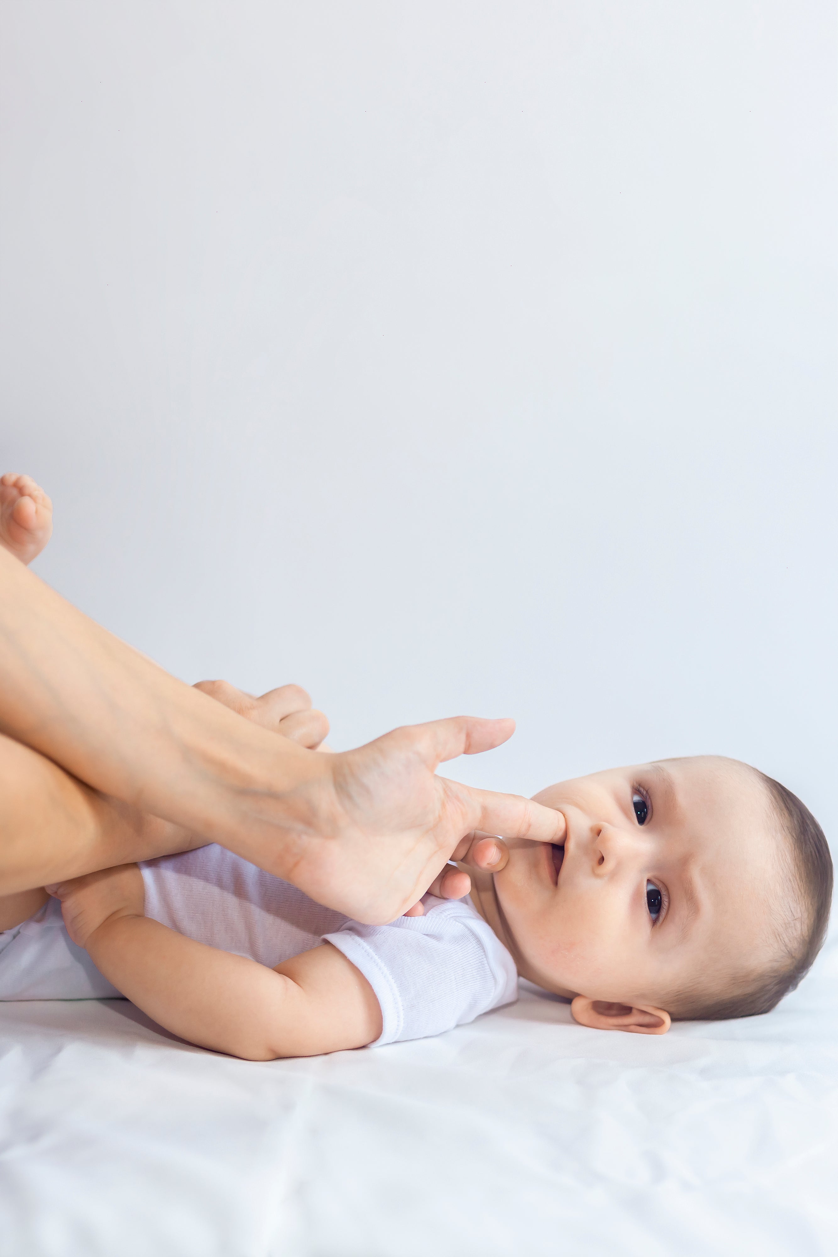 Mother using tactics for baby crying at night while teething