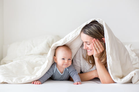 Baby holding head up motor skills development