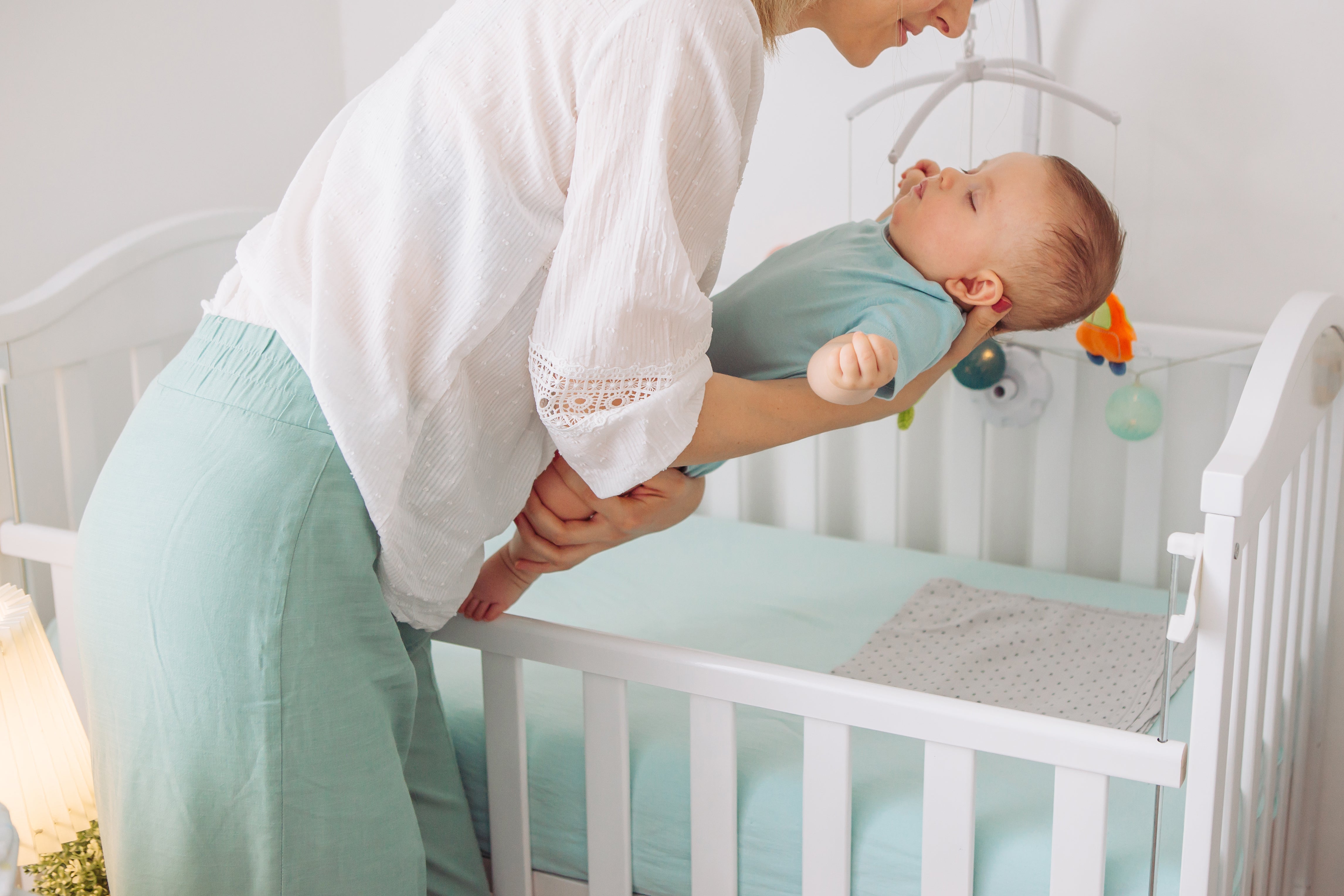 Mom practicing how to help baby sleep