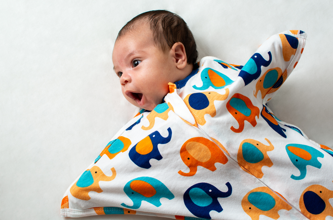 Young baby wearing Zipadee-Zip to help them stop crying at night