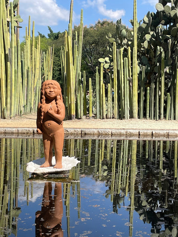 Statue and pond at botanical garden