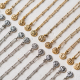 gold and silver zodiac charm pendants