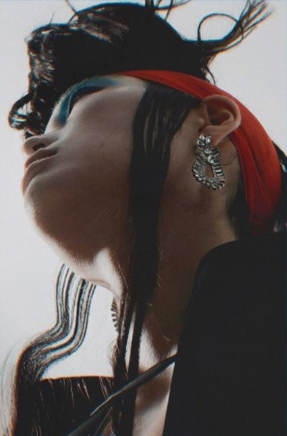 Tush magazine model in Ben-Amun crystal earrings