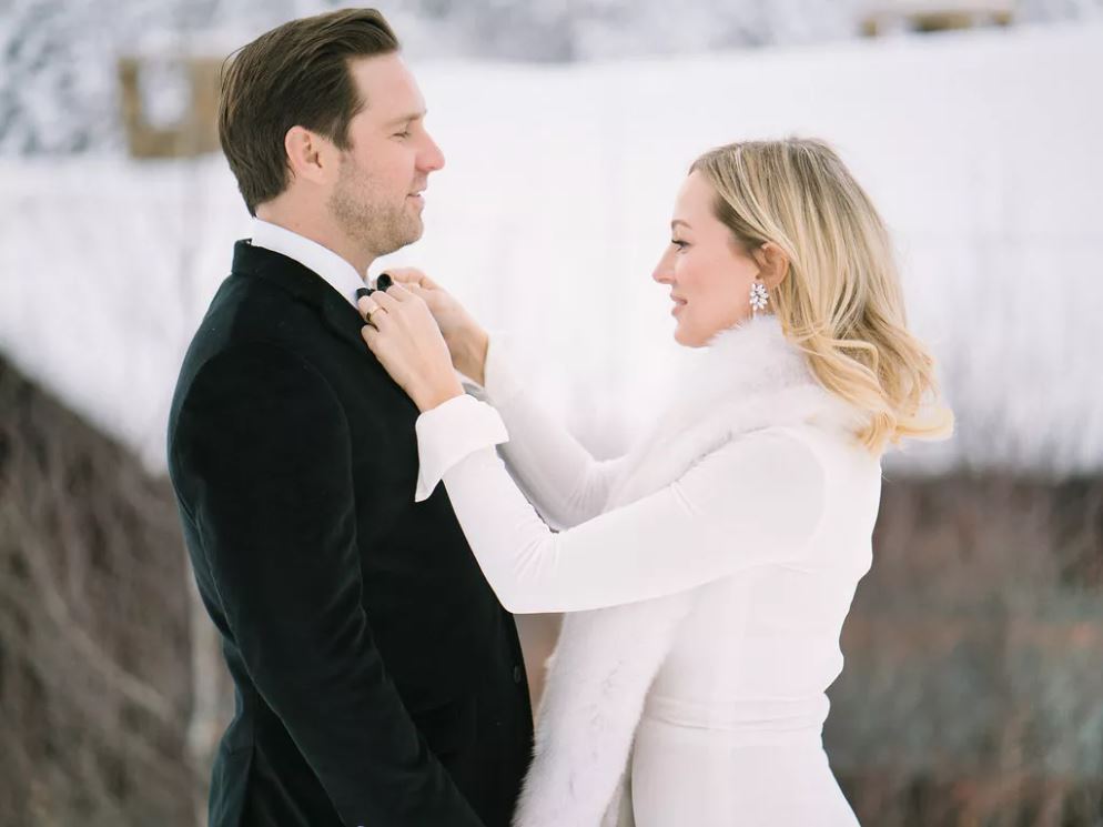 A lovely couple looking at each other. The bride wears silver crystal earrings