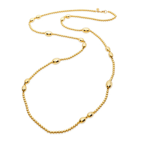 Long gold necklace with ball details