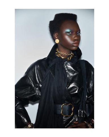 Model wears gold coin earrings from Ben-Amun