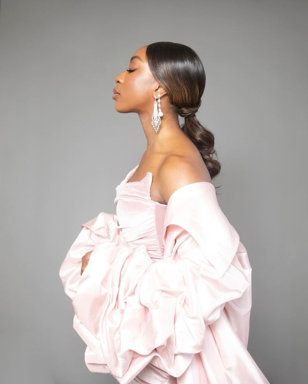 Ego Nwodim in crystal earrings and pink dress
