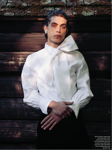 Male model in white shirt with bow and one crystal earring