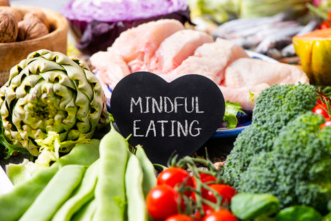 a tray of fruits and vegetables with a heart shaped sign to help reduce the connection between obesity and immunity.