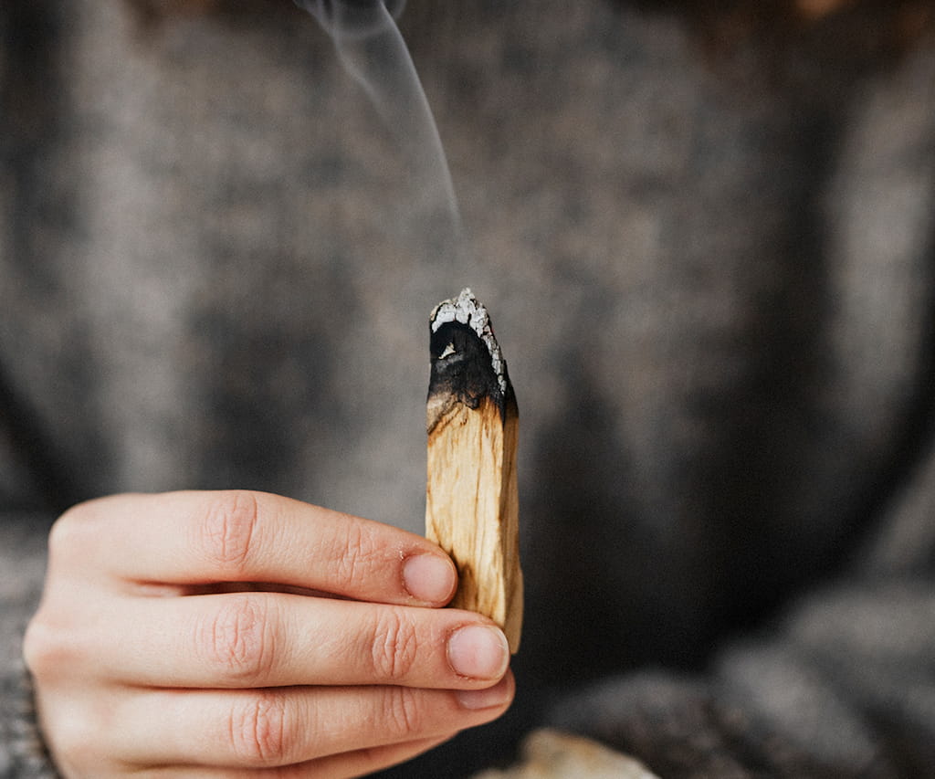 Light a Palo Santo stick, envelop yourself in the aromatic smoke