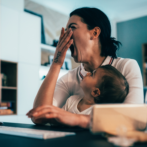 Tired Woman Yawning with Baby