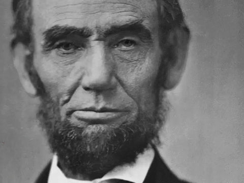 Black and white portrait of Abraham Lincoln, the 16th President of the United States, known for his distinctive beard and leadership during the American Civil War.