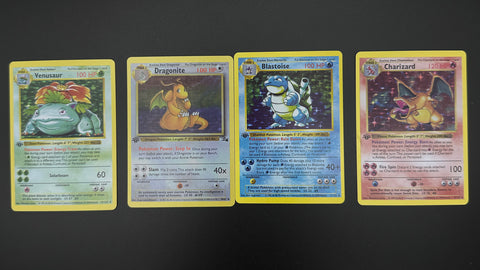 A picture of four fake 1st edition pokemon cards