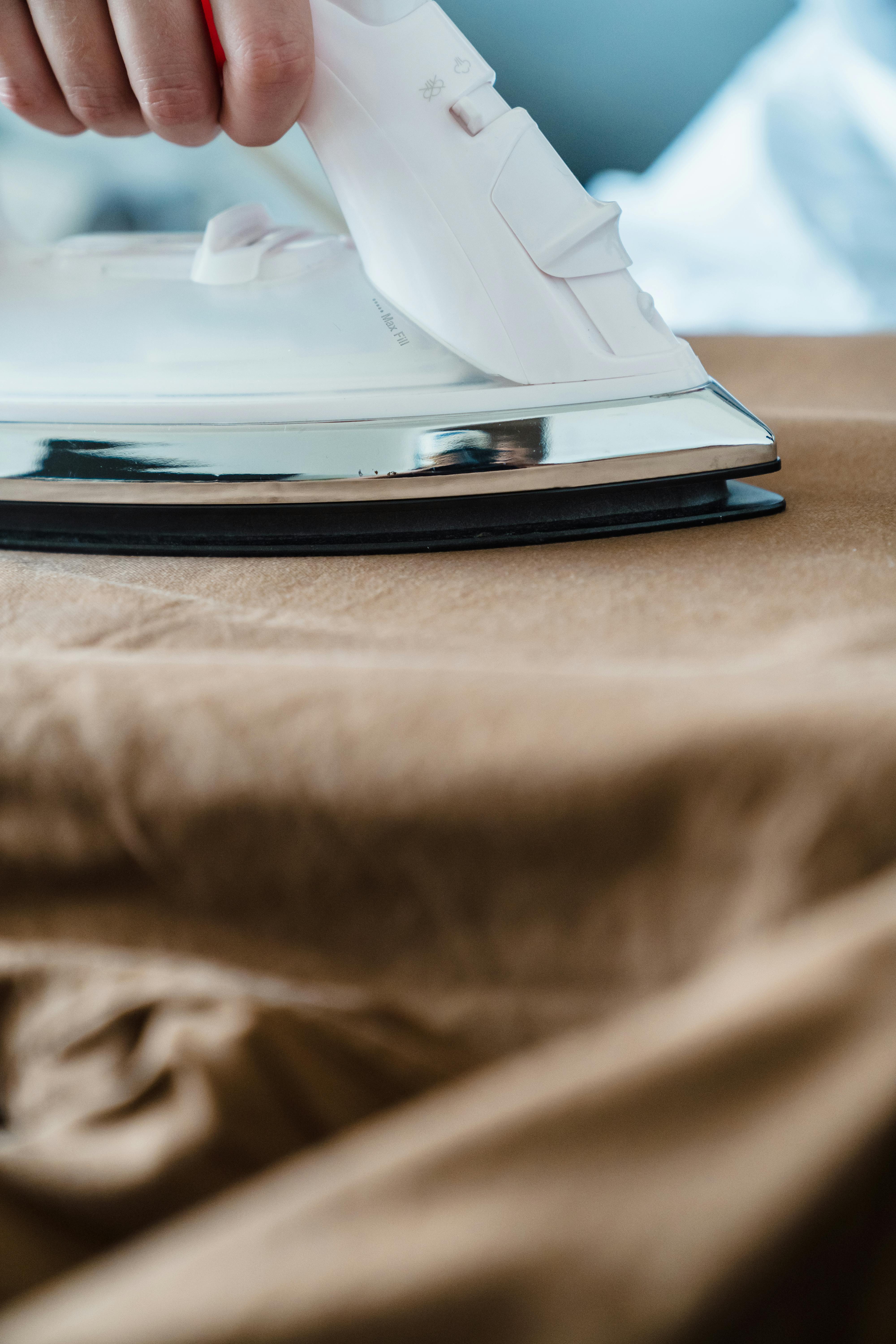 Brown sheets being ironed