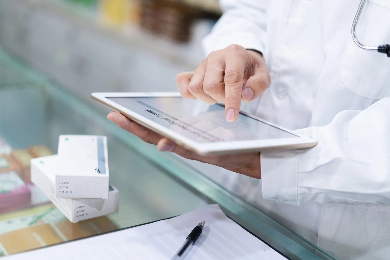 A pharmacist using a tablet