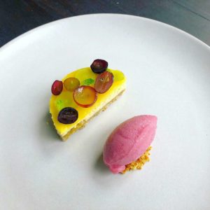 cheesecake with burrata and grapes and lemon