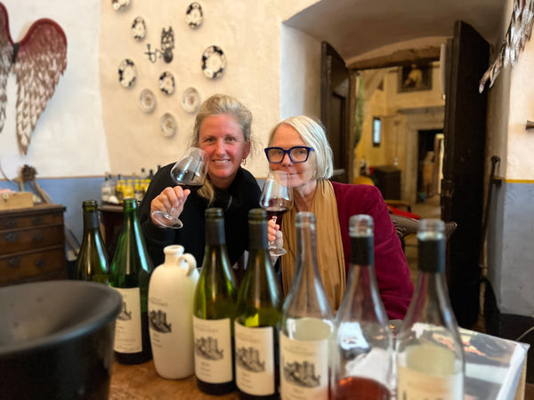 two women enjoying a glass of wine together