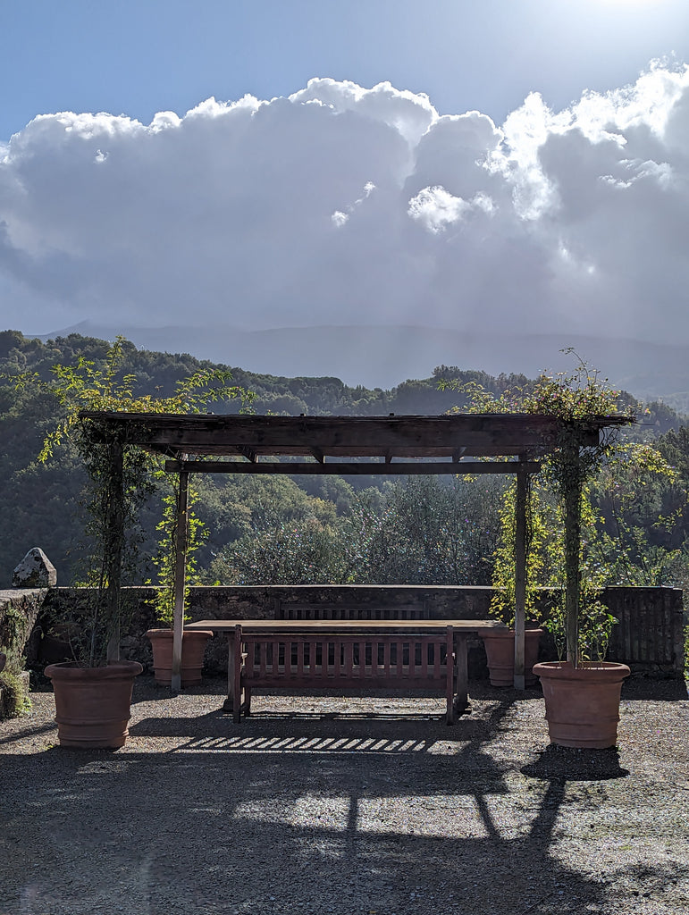dreamy scene of table with clouds overlooking Mount Amiata