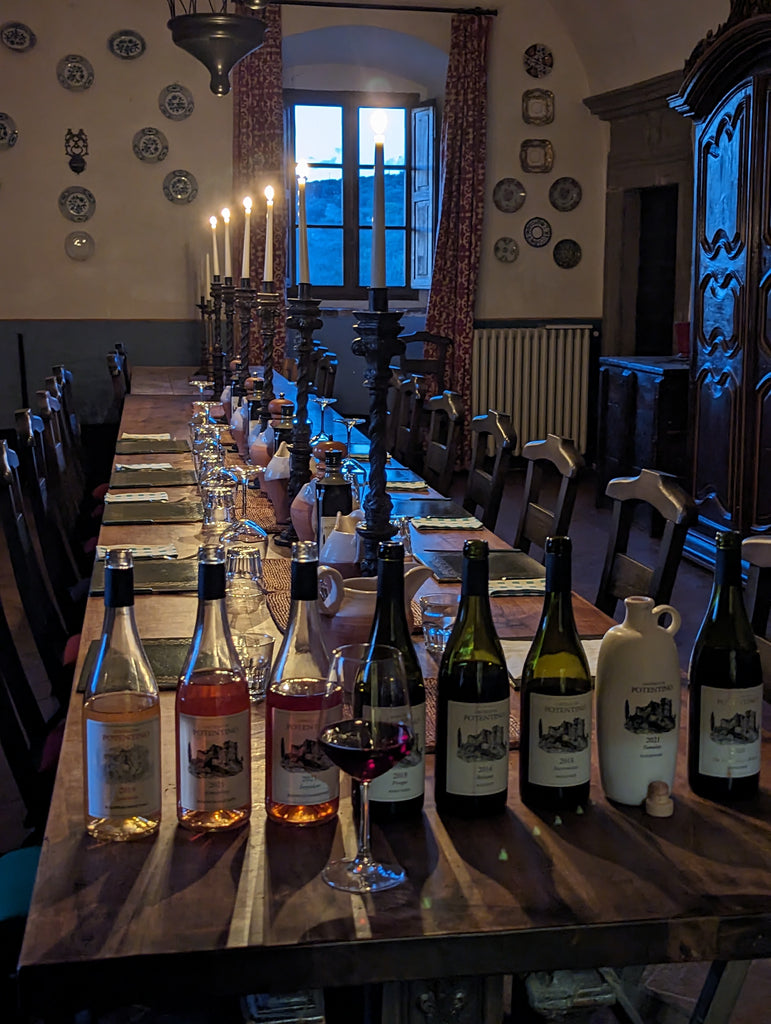 sunset on wine bottle in dining room of castle