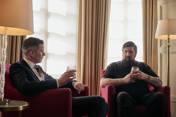 A photo of Campbell enjoying a whisky with House of Hazelwood's Sampling Lead, George