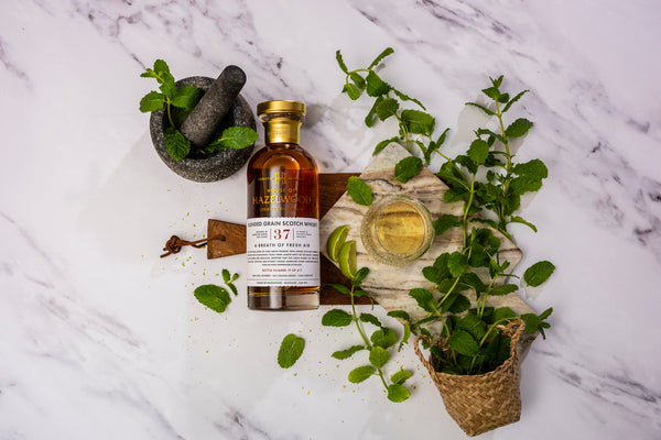 A Breath of Fresh Air whisky surrounded by mint symbolising mint esters