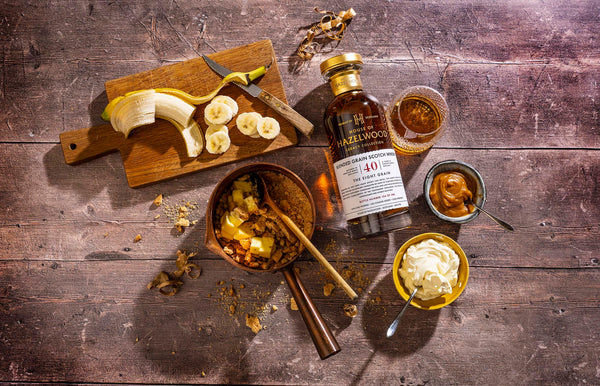 A bottle of The Eight Grain surrounded by a deconstructed banoffee pie
