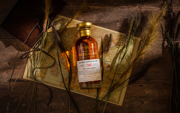 A bottle of the Lowlander whisky laid out on a map of the region