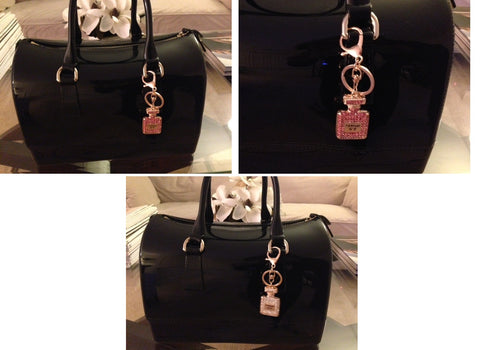 pov of parfum charms on purse