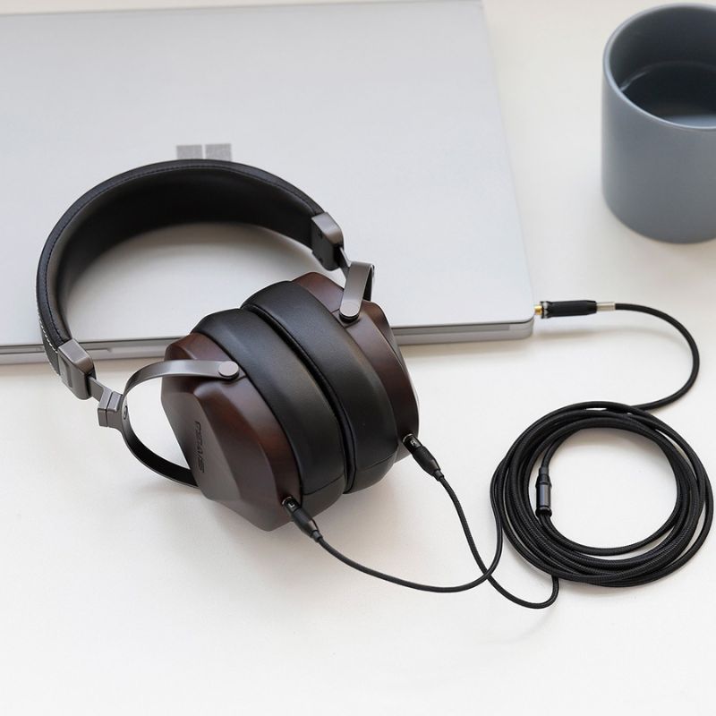 sivga oriole headphone laid flat on a table with coiled cables