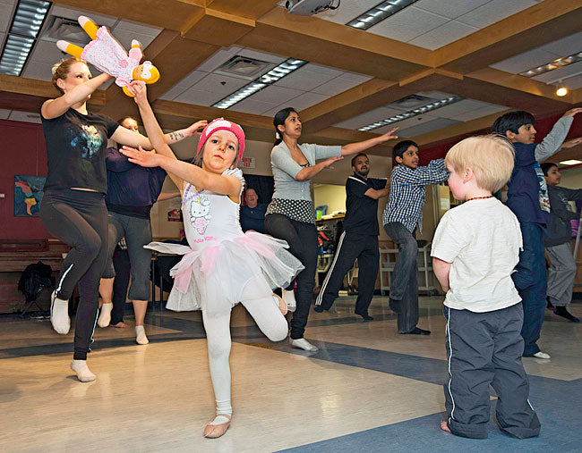 Children and adults together learning Bhangra from Gurdeep at the L’AFY (Yukon French Association) building in Whitehorse in 2013