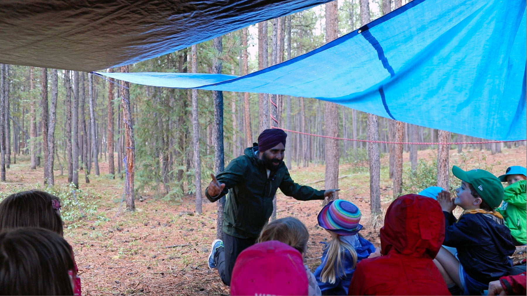Gurdeep is sharing and learning with young children near a forest in Whitehorse in nature and open outdoor environment. The class was facilitated by Rivers to Ridges, an outdoor learning school in Whitehorse, Yukon.