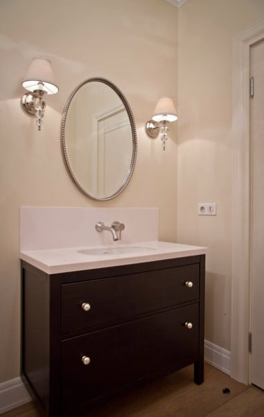 Uttermost Sherise Oval Wall Mirror in the bathroom