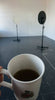 Cup of tea in front of simon starlings venus mirror
