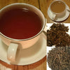 cup of keemun imperial anhui with and without milk and leaves