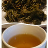 cup of nepal antu valley tea and tea leaves